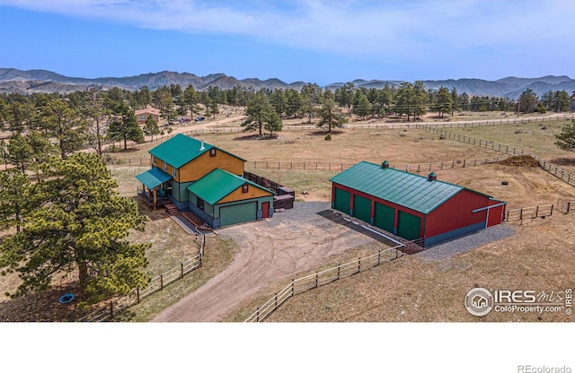 drone / aerial view featuring a mountain view and a rural view