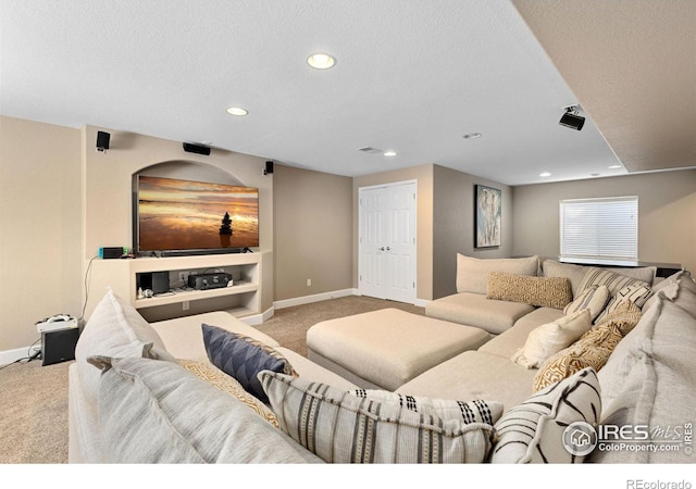 carpeted living room featuring visible vents, recessed lighting, baseboards, and a textured ceiling