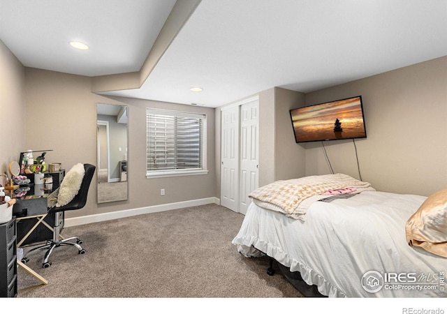 carpeted bedroom with a closet, recessed lighting, and baseboards