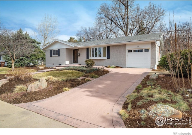 ranch-style house featuring brick siding, driveway, and a garage