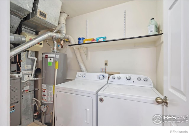 laundry area with independent washer and dryer, laundry area, and water heater