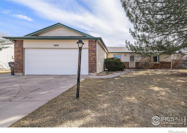 ranch-style home with brick siding, an attached garage, and concrete driveway