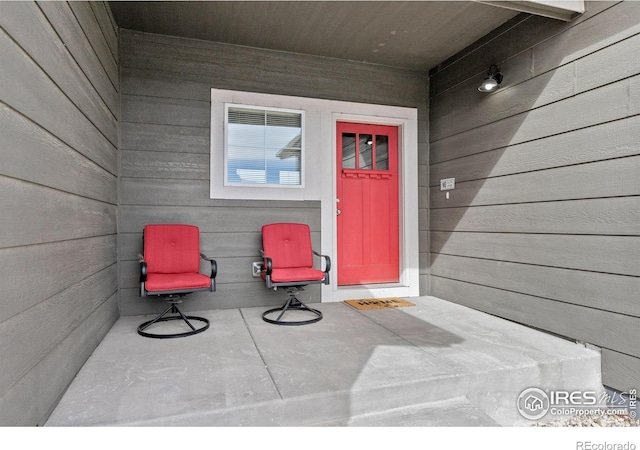 entrance to property featuring a patio