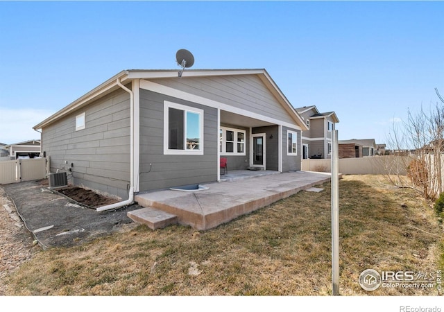3948 Hackberry St, Wellington, CO 80549 - back of property with a yard, a patio area, fence, and cooling unit