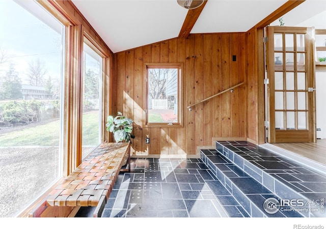 interior space featuring vaulted ceiling with beams