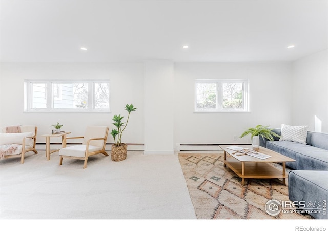 living area featuring recessed lighting, a baseboard heating unit, baseboards, and carpet floors