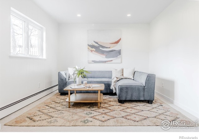 living area with recessed lighting and baseboard heating