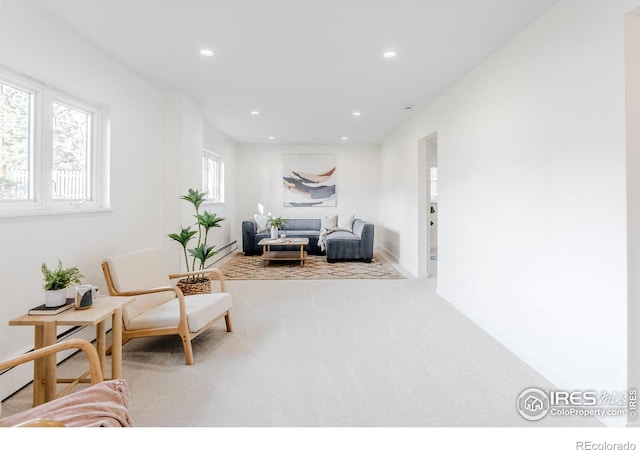 sitting room with recessed lighting and carpet floors