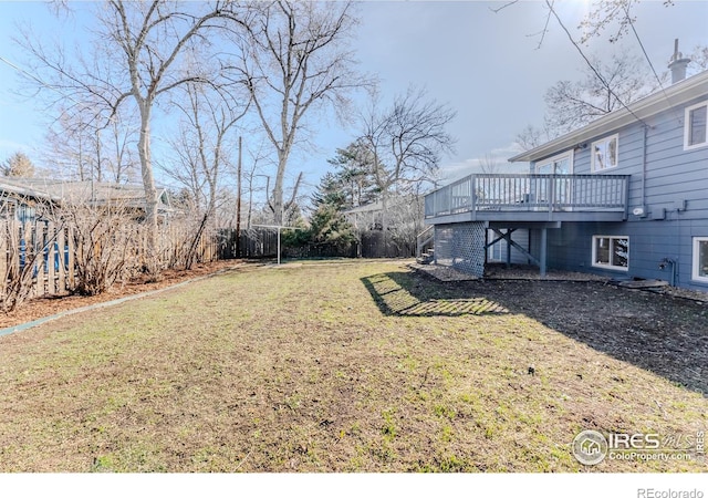 view of yard featuring a wooden deck and stairs