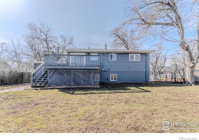 back of house featuring stairway, a yard, fence, and a wooden deck