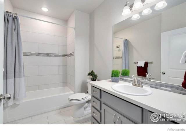 full bath featuring vanity, shower / tub combo, toilet, and tile patterned flooring