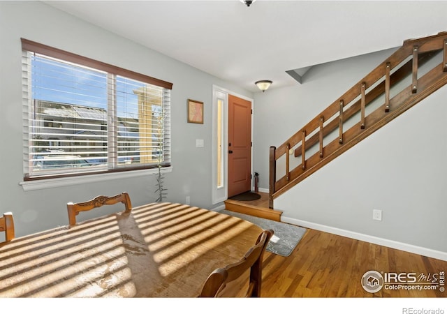 bedroom featuring baseboards and wood finished floors