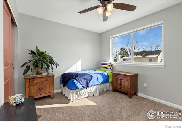 bedroom with carpet, baseboards, and ceiling fan