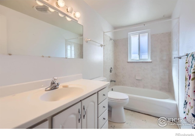 bathroom with toilet, vanity, and shower / bath combo