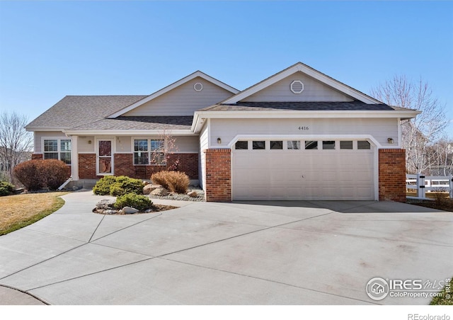 ranch-style home featuring concrete driveway, a garage, brick siding, and a shingled roof