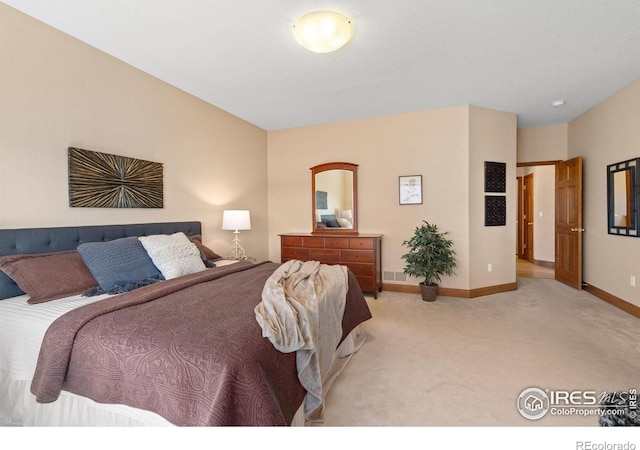 bedroom with visible vents, baseboards, and carpet flooring