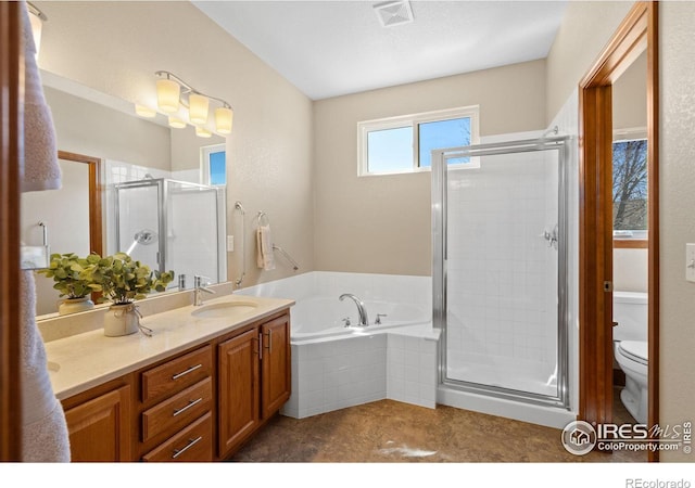 full bath with vanity, a bath, visible vents, a shower stall, and toilet