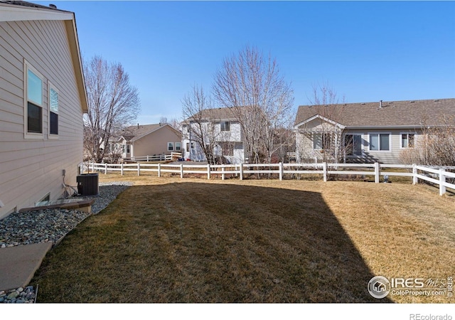 view of yard with cooling unit and a fenced backyard