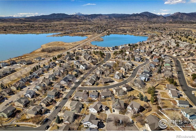 birds eye view of property with a residential view and a water and mountain view