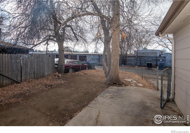 view of yard featuring a patio area and fence