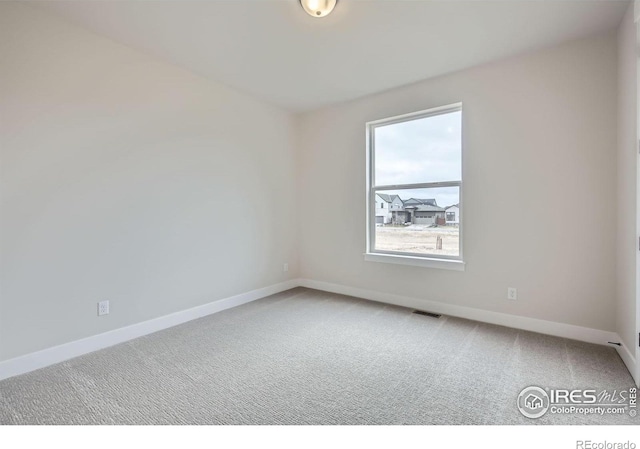 1685 Crystalline Dr, Windsor, CO 80550 - carpeted empty room with baseboards and visible vents
