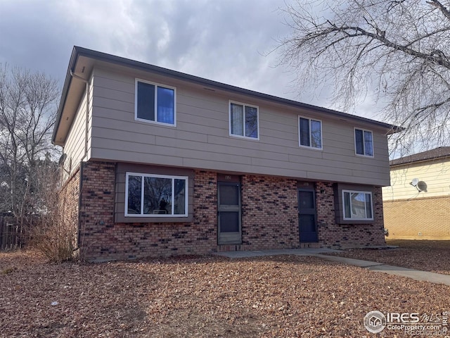 1351 Emery St, Longmont, CO 80501 - colonial-style house with brick siding