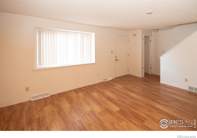 1351 Emery St, Longmont, CO 80501 - unfurnished room featuring visible vents and wood finished floors