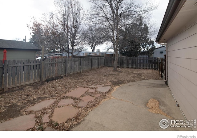 1351 Emery St, Longmont, CO 80501 - view of yard with a patio area and a fenced backyard