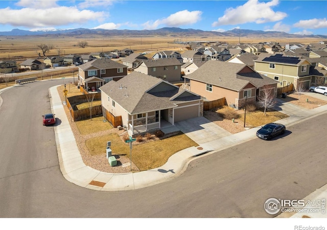 aerial view with a mountain view and a residential view