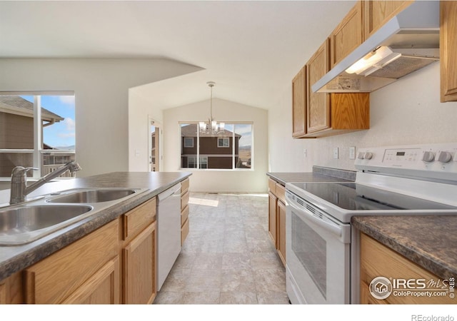 kitchen featuring dark countertops, under cabinet range hood, lofted ceiling, white appliances, and a sink