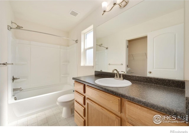 full bathroom with visible vents, toilet, shower / washtub combination, and vanity