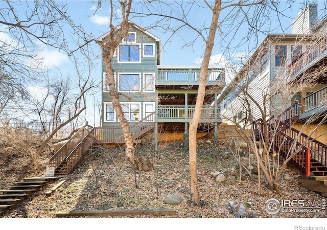 rear view of house with stairs