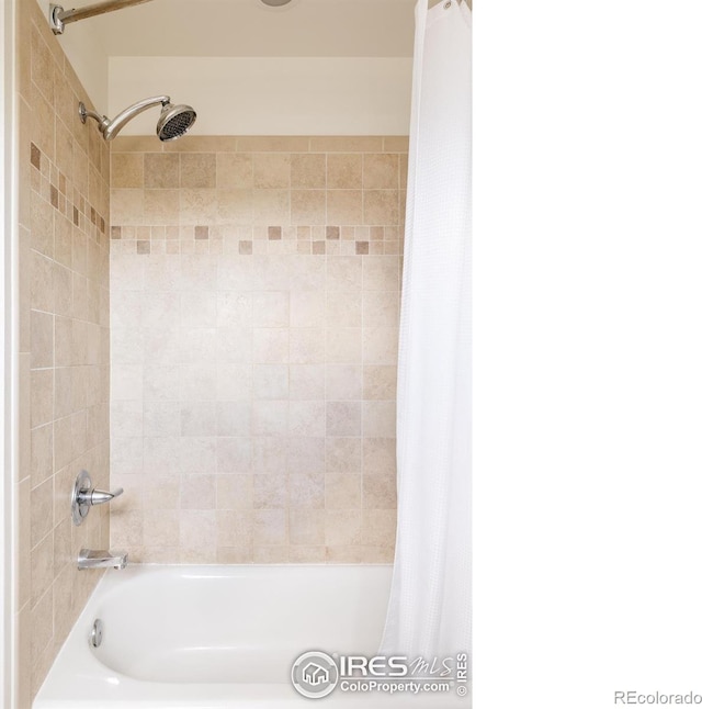 bathroom featuring shower / bathtub combination with curtain