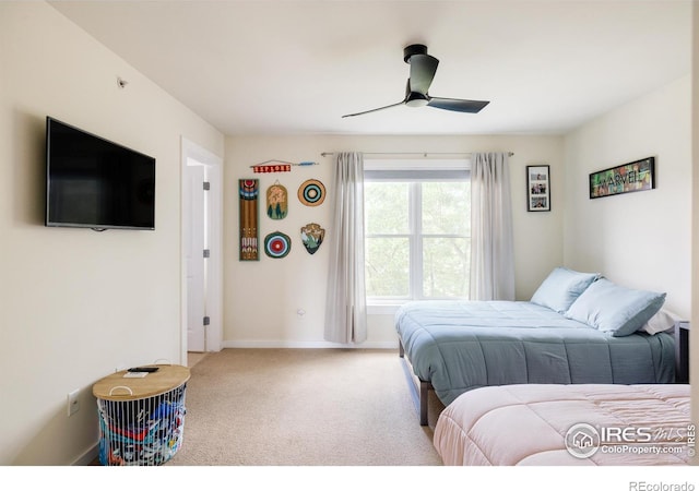 bedroom with baseboards, carpet floors, and a ceiling fan