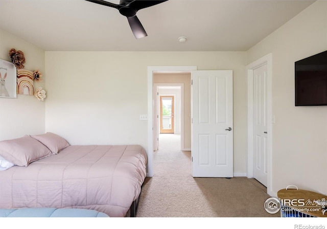 carpeted bedroom with a ceiling fan