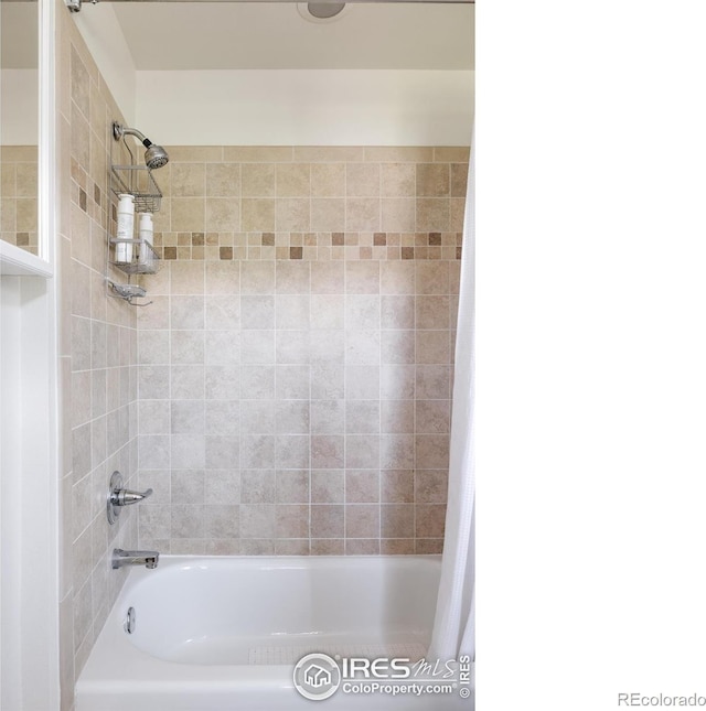 full bathroom with shower / tub combo