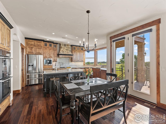 dining space with recessed lighting, visible vents, an inviting chandelier, and dark wood-style floors