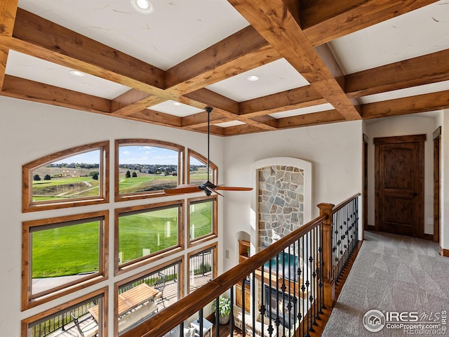 hallway featuring carpet, coffered ceiling, recessed lighting, beamed ceiling, and an upstairs landing