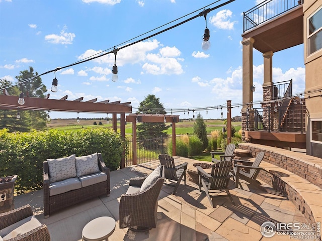 view of patio / terrace featuring stairs, outdoor lounge area, and a pergola