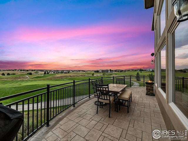 exterior space with grilling area, a rural view, and outdoor dining area