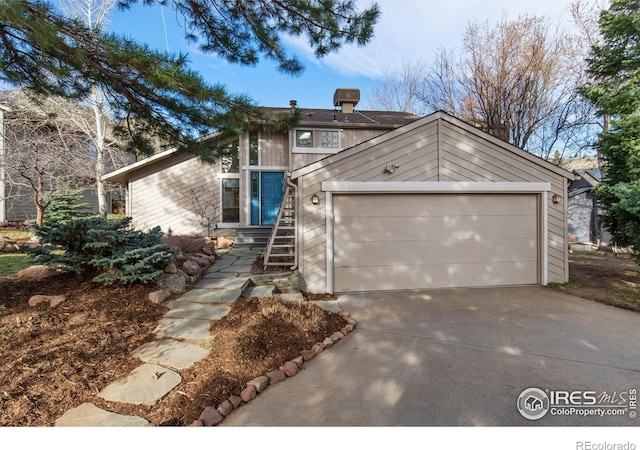 view of front of property with a garage and driveway