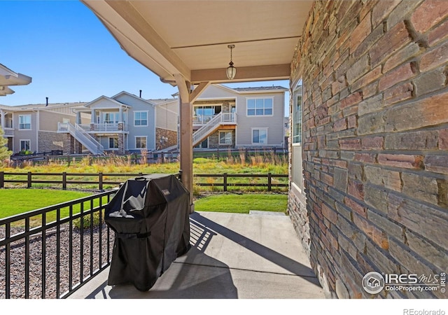 view of patio featuring area for grilling and a residential view