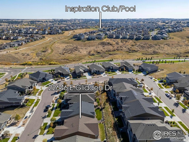 birds eye view of property with a residential view