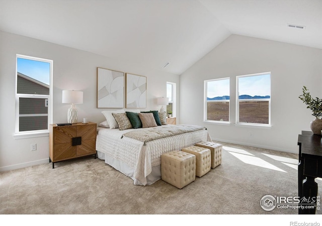 bedroom featuring baseboards, visible vents, carpet floors, and lofted ceiling