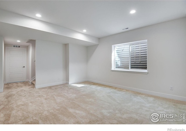 basement featuring recessed lighting, visible vents, and carpet