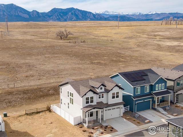 bird's eye view featuring a rural view and a mountain view