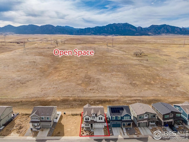 birds eye view of property with a residential view, a rural view, and a mountain view