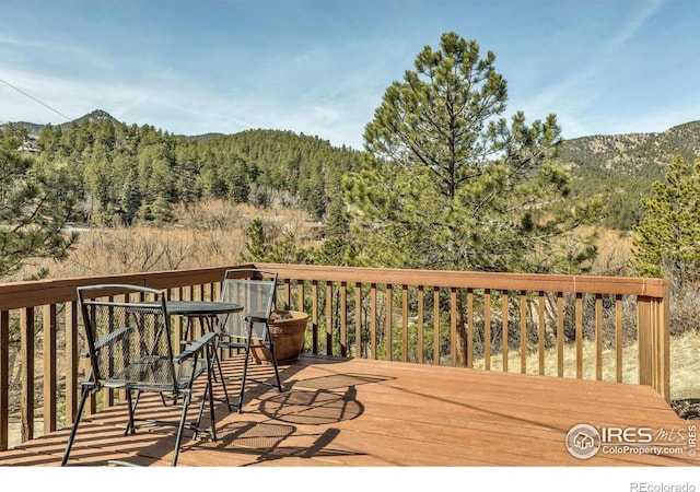 15 Golden Age Rd, Jamestown, CO 80455 - deck featuring a wooded view and a mountain view