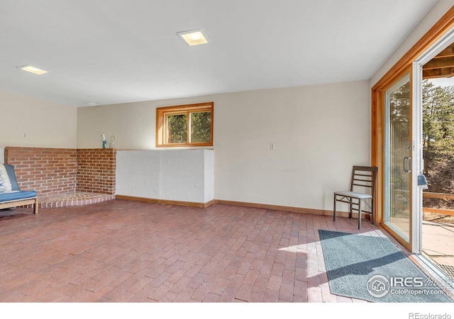 15 Golden Age Rd, Jamestown, CO 80455 - unfurnished room featuring brick flooring and baseboards