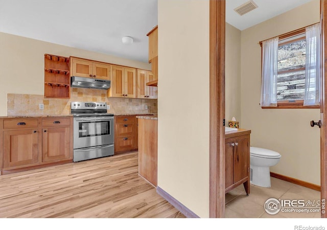 15 Golden Age Rd, Jamestown, CO 80455 - kitchen with stainless steel range with electric cooktop, under cabinet range hood, open shelves, tasteful backsplash, and light stone counters